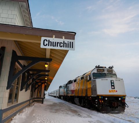 Via Rail train waiting  at the station in Churchill in winter